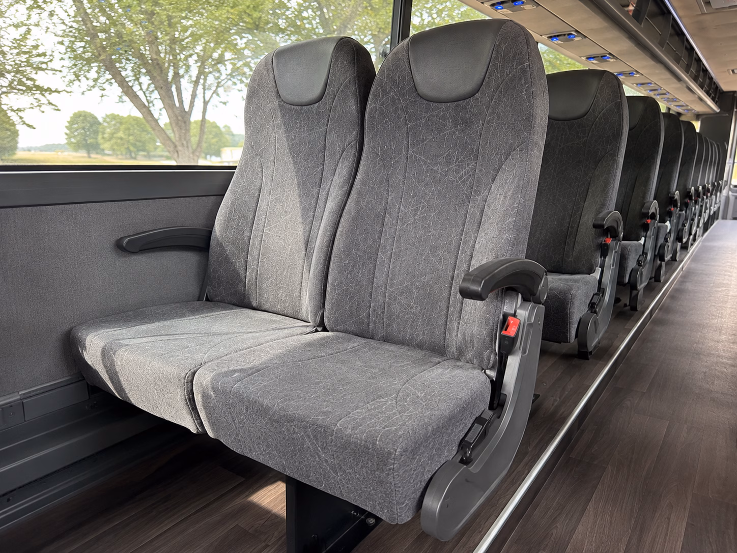 how seasonality and peak times affect charter bus rental prices in lawrence